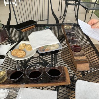 Freedom Run Winery - 4 wines for $5. Love the flight paddle - made with reclaimed wood from the oak barrels! I love that! - Wine Tasting Room Near Me - Lockport, New York