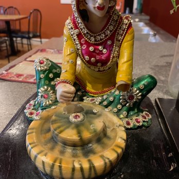 Samosa Gardens - a figurine of a woman sitting on a water fountain - Middle Eastern Near Me - Keremeos, British Columbia Samosa Gardens - a figurine of a woman sitting on a water fountain - Middle Eastern Near Me - Keremeos, British Columbia