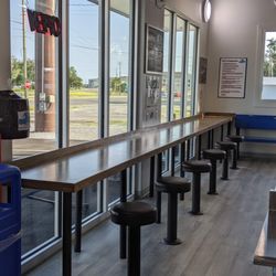 Bolted down padded seating at our long table where you can sit and enjoy the views of the bay,bring your laptop or a meal, or use it to fold