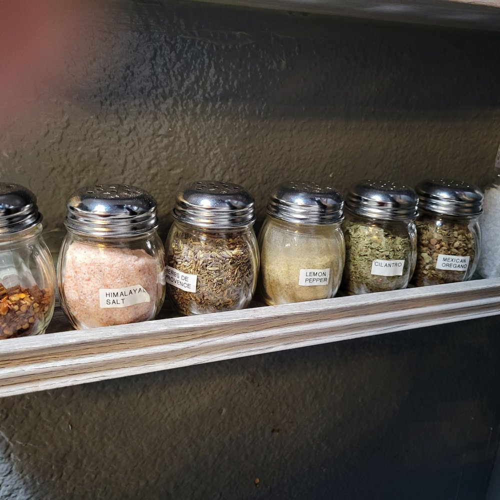 Chai Coffee Co - This is not just a coffee spot. They make keto friendly foods, bagel sandwiches, etc. This shelf holds herbs dispensers. - Coffee & Tea Near Me - Yucaipa, California Chai Coffee Co - This is not just a coffee spot. They make keto friendly foods, bagel sandwiches, etc. This shelf holds herbs dispensers. - Coffee & Tea Near Me - Yucaipa, California