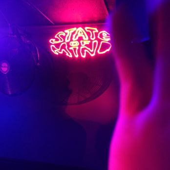 Serj - a neon sign in a dark room - Dance Clubs Near Me - Charlotte, North Carolina