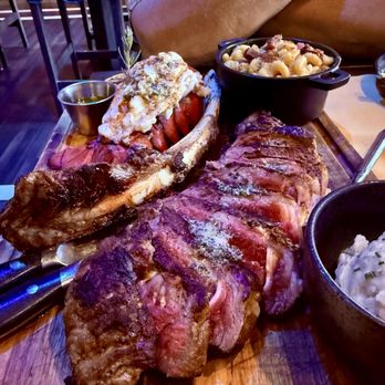 Freddy’s Chophouse - Surf and turf with garlic mashed potatoes and jalepeno bacon Mac and cheese. - American Near Me - San Diego, California