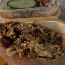 Kings Kebab - Carved chicken in a pita bread with a variety of cabbage slaw with cucumber and tomatoes.