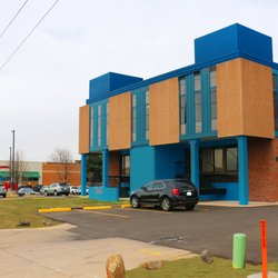 Gregory G Farthing, DDS, MSD, PC - Front of the Building. Please park in the back to access our suite more easily!