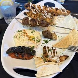 kebobs trio with rice ,hummus and pita kebobs trio with rice ,hummus and pita