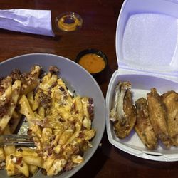Tail Race Tavern - Covered fries and wings.