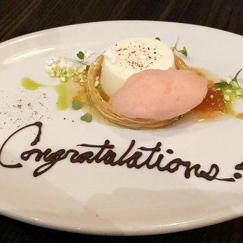 Vida - This was our buttermilk panna cotta with Negroni sorbet (and a congratulations as a bonus). OMG. - New American Near Me - Indianapolis, Indiana