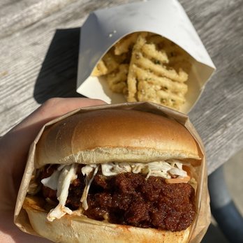 Eureka Eatery - Cluckin chicken sandwich (spice level- hot), and the truffle fries that I had already dug into on our way to the park. - Sandwiches Near Me - Monroe, Michigan