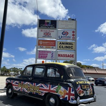 The British Depot - an old car with a british flag on it - Grocery Near Me - Oakland Park, Florida