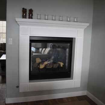 C C Mouldings - a fireplace in a living room - Cabinetry Near Me - Albuquerque, New Mexico
