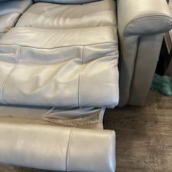 Obvious tear that we did not notice right away because when you are sitting in the reclining couch your feet cover this area.