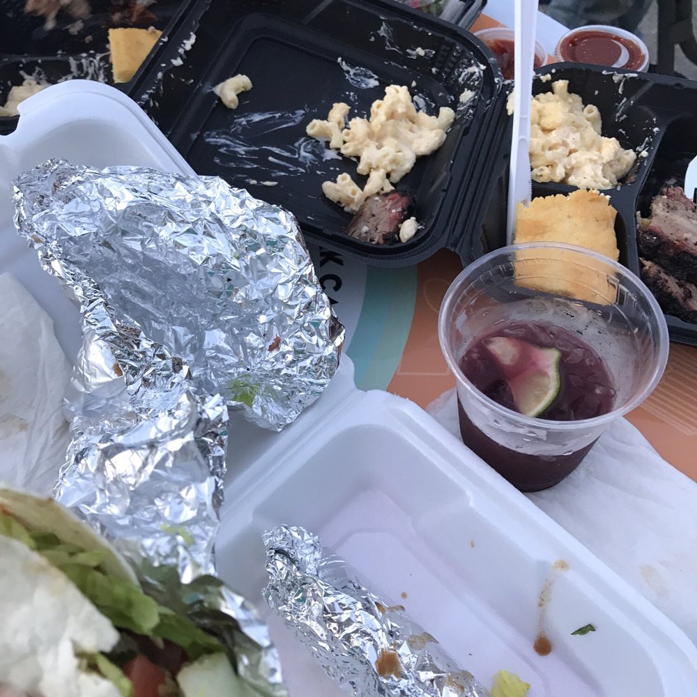 Poco Loco Taco Truck - a person holding a hot dog - Mexican Near Me - Cranston, Rhode Island Poco Loco Taco Truck - a person holding a hot dog - Mexican Near Me - Cranston, Rhode Island