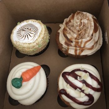 The Cake Cottage - From left to right Key Lime Cupcake, Caramel Apple Cupcake, Carrot Cupcake and White Chocolate Raspberry Cupcake - Desserts Near Me - Murrieta, California The Cake Cottage - From left to right Key Lime Cupcake, Caramel Apple Cupcake, Carrot Cupcake and White Chocolate Raspberry Cupcake - Desserts Near Me - Murrieta, California