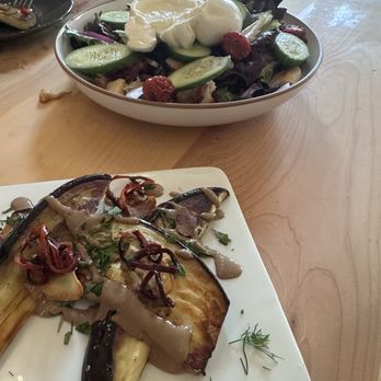 Terra Kitchen - We were so excited to eat that we forgot to take pictures right away! Here is part of the eggplant starter and our salad. - New American Near Me - Redmond, Oregon Terra Kitchen - We were so excited to eat that we forgot to take pictures right away! Here is part of the eggplant starter and our salad. - New American Near Me - Redmond, Oregon