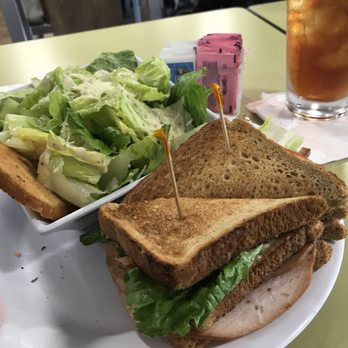 Stinger Ray's Tropical Bar & Grill - Turkey club sandwich and Caesar salad - Bars Near Me - Honolulu, Hawaii Stinger Ray's Tropical Bar & Grill - Turkey club sandwich and Caesar salad - Bars Near Me - Honolulu, Hawaii
