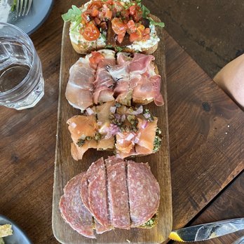 Postino East - Bruschetta Board - burrata, prosciutto and fig, smoked salmon, pesto and salami - Wine Bars Near Me - Gilbert, Arizona Postino East - Bruschetta Board - burrata, prosciutto and fig, smoked salmon, pesto and salami - Wine Bars Near Me - Gilbert, Arizona