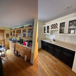 A&A Home Experts - Refreshed bar area with painted cabinets, a stylish backsplash, updated handles, and a perfect blend of two complementary colors.