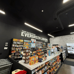 Evergreen Liquors checkout with smoke, snack, and refrigerated selection