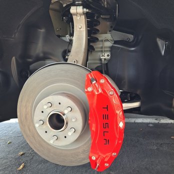 Z Performance Mobile Auto Service - Tesla Model Y getting brake caliper covers installed - Auto Repair Near Me Z Performance Mobile Auto Service - Tesla Model Y getting brake caliper covers installed - Auto Repair Near Me