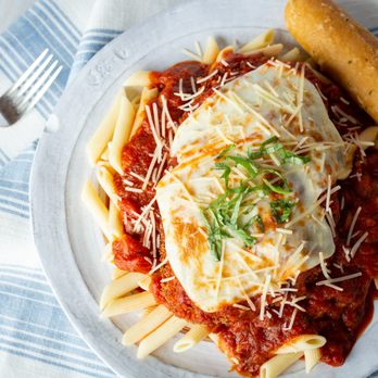 Max & Erma's - a plate of pasta with sauce and cheese - Burgers Near Me - Edinburgh, Indiana