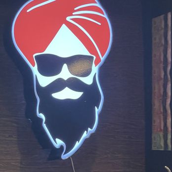 Sardar ji - a man with a red turban and sunglasses - Indian Near Me - Brampton, Ontario