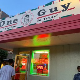 people walking in front of a restaurant