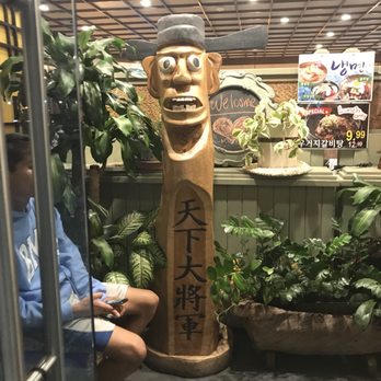 Kaju Soft Tofu - Tiki statues at entrance - Korean Near Me - Buena Park, California Kaju Soft Tofu - Tiki statues at entrance - Korean Near Me - Buena Park, California
