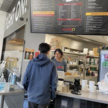 Ramen Kenjo - a man and a woman standing at a counter - Ramen Near Me - Los Angeles, California Ramen Kenjo - a man and a woman standing at a counter - Ramen Near Me - Los Angeles, California