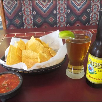 El Ranchero - Appitizers:  In-house-made salsa, fresh chips, and an icy-cold Pacifico beer, complete with a lime wedge. - Mexican Near Me - Longview, Washington