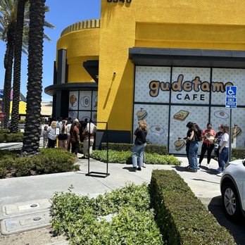 Gudetama Cafe - Line wrapped around the building-- it's about a 3 hr wait if you see it like this - Cafes Near Me - Buena Park, California
