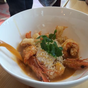 China Chilcano - Shrimp with head-on and broth being poured over it at China Chilcano - Peruvian Near Me - Washington, DC, District of Columbia