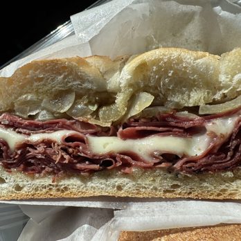 Long Island Bagel Cafe - Hot Roll with corned beef pastrami mozz cheese butter garlic and caramelized onions - Bagels Near Me - Mineola, New York Long Island Bagel Cafe - Hot Roll with corned beef pastrami mozz cheese butter garlic and caramelized onions - Bagels Near Me - Mineola, New York
