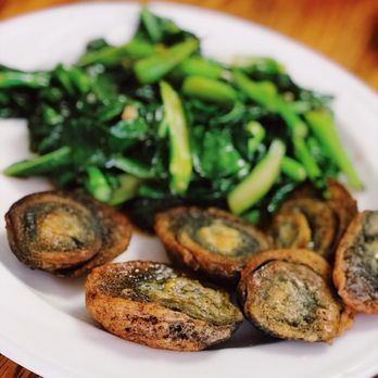 Friends Cafe - Century eggs with Chinese broccoli - Thai Near Me - Roseville, Minnesota Friends Cafe - Century eggs with Chinese broccoli - Thai Near Me - Roseville, Minnesota
