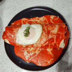 The Stacked Enchilada - Black Angus Beef Tenderloin, enchilada style with an over easy egg, delicious!