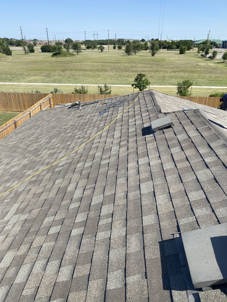 Slide of Rey's roofing and contractors