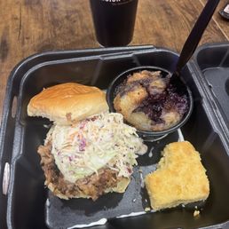 Pulled pork sandwich, blueberry cobbler, and cornbread.