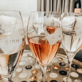 SIGH - three glasses of rose wine on a tray - Champagne Bars Near Me - Sonoma, California SIGH - three glasses of rose wine on a tray - Champagne Bars Near Me - Sonoma, California