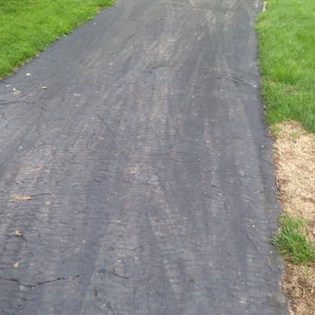 Distinctive Lawn And Landscape - more damage to my driveway (those marks haven't left after four weeks and lots of rain) - Tree Services Near Me - Columbus, Ohio