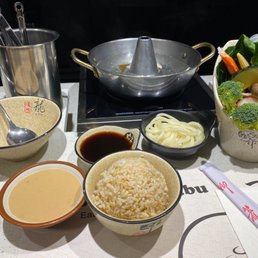 Set up of one entree - konbu broth with brown rice Set up of one entree - konbu broth with brown rice