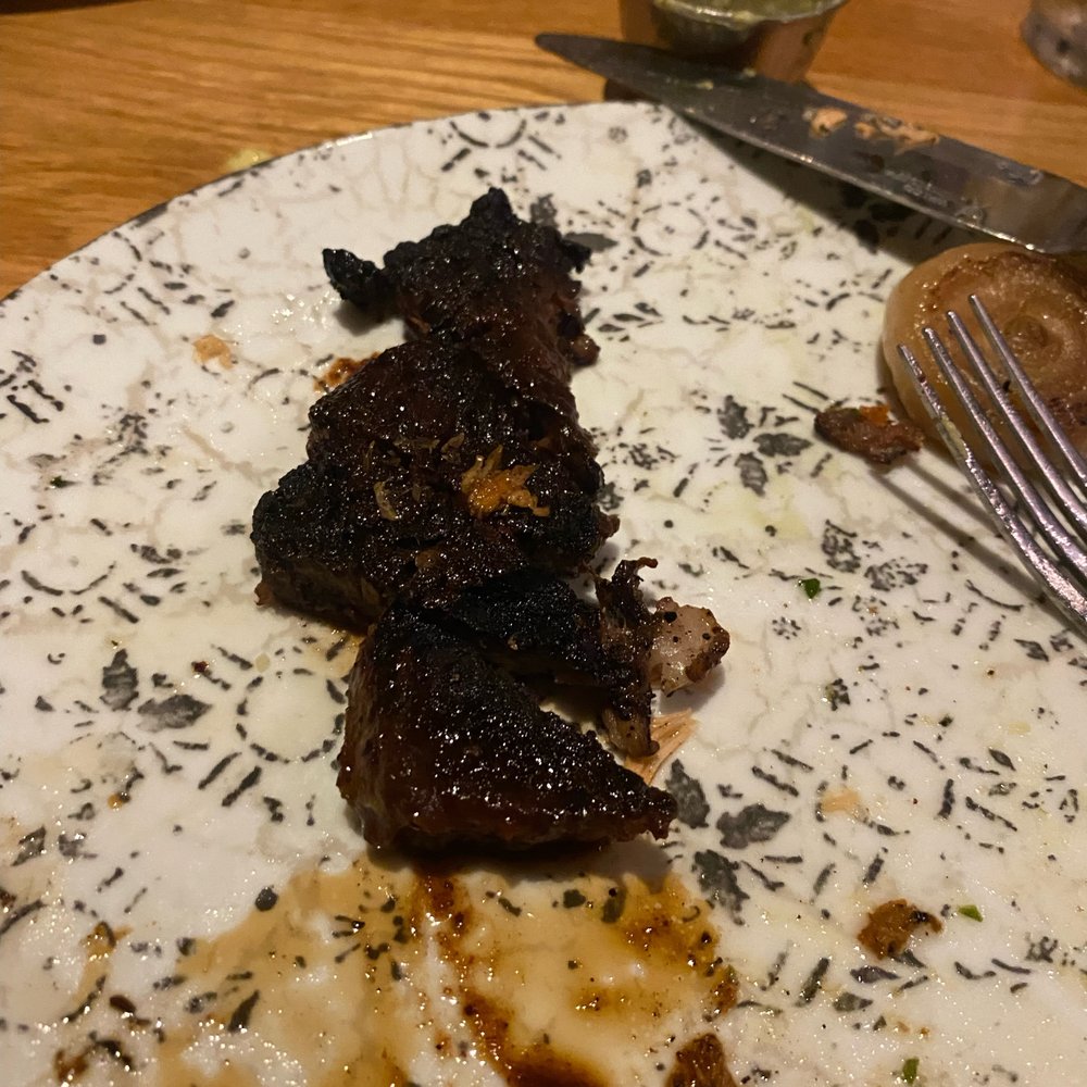 Bigfire - The burnt steak that was considered a "mishap" by the manager. It was flipped on the other side that wasn't as burnt when served to us. - American Near Me - Orlando, Florida Bigfire - The burnt steak that was considered a "mishap" by the manager. It was flipped on the other side that wasn't as burnt when served to us. - American Near Me - Orlando, Florida