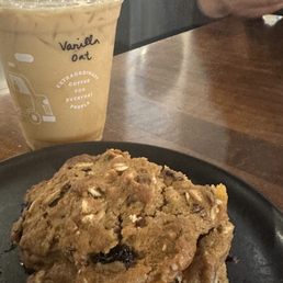 Iced vanilla latte made and a trail mix scone