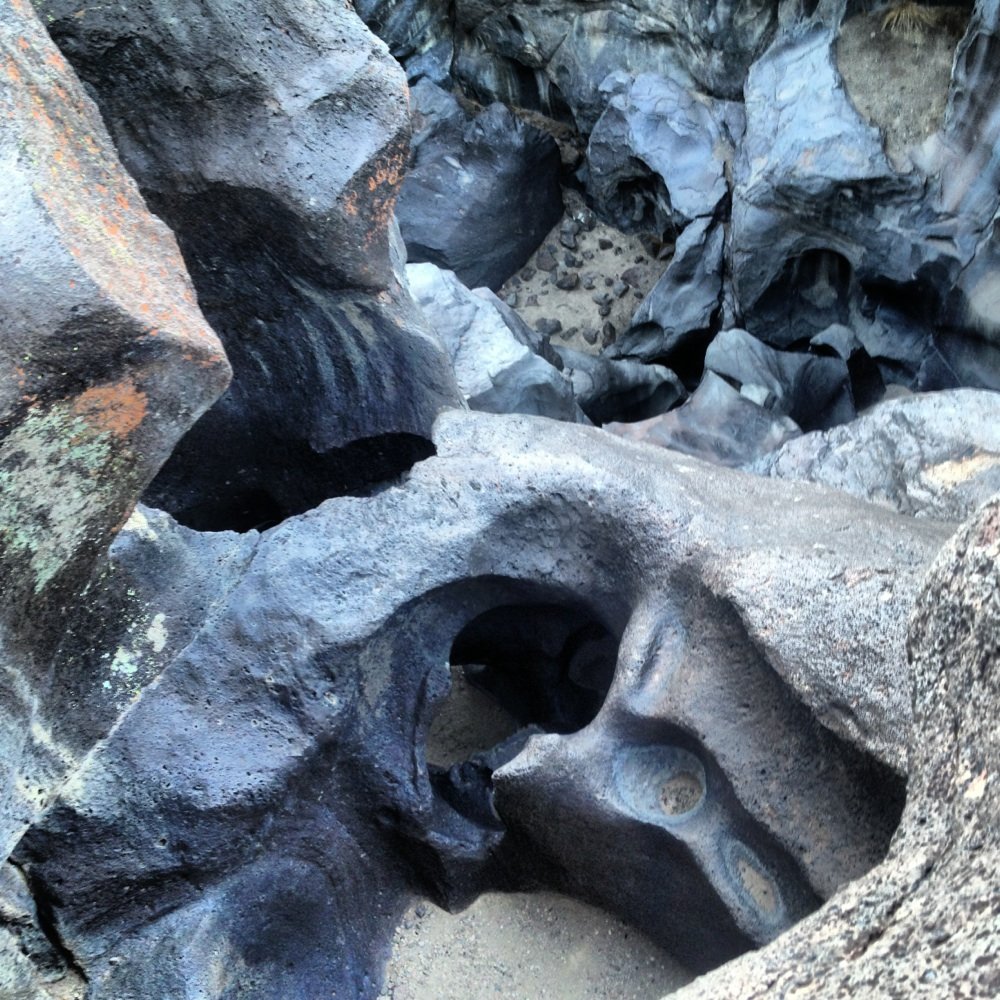 Fossil Falls - Center diamond shaped sand floor is a 5 story decent. Closest at bottom is less than 5 foot drop. Hard to scale. - Hiking Near Me - Little Lake, California Fossil Falls - Center diamond shaped sand floor is a 5 story decent. Closest at bottom is less than 5 foot drop. Hard to scale. - Hiking Near Me - Little Lake, California