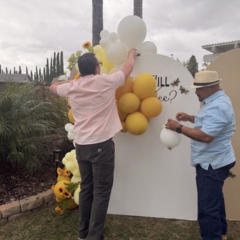 Lala's Party Creations - My husband and father fixing the backdrop - Party Equipment Rentals Near Me - Van Nuys, California