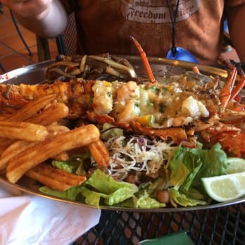 La Parrilla - My husbands plate with the other half of the meal. - Latin American Near Me - Luquillo, Puerto Rico La Parrilla - My husbands plate with the other half of the meal. - Latin American Near Me - Luquillo, Puerto Rico
