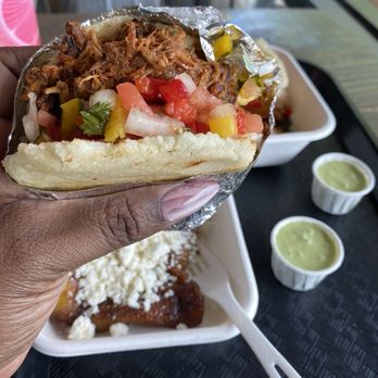 Arepa Culture NC - Handful of La Surena arepa - Venezuelan Near Me - Raleigh, North Carolina Arepa Culture NC - Handful of La Surena arepa - Venezuelan Near Me - Raleigh, North Carolina