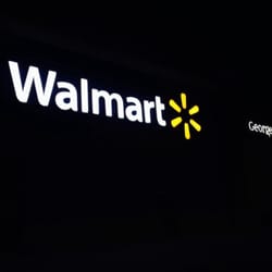 WalMart - Walmart sign at night.