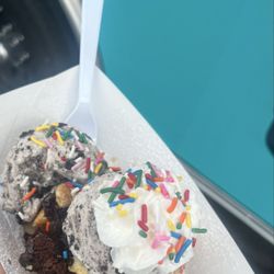 Kiylee Kakes - Bomb Brownie w/ cheesecake pieces, a scoop and a half of cookies and cream icream, whipped topping, and sprinkles (for the crunch)