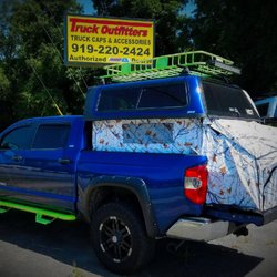 Truck Outfitters - 2014 Tundra with a 6" lift kit, Overland series cap, topper EZ lift and tent option