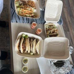 (L-R clockwise) Crunchy taco combo, 2 dry burritos, fish, Al pastor, cabeza tacos, carne asada and steak mexicana tacos