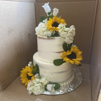 Elegant Bakery - a three tiered cake decorated with sunflowers - Bakeries Near Me - Lakewood, Colorado